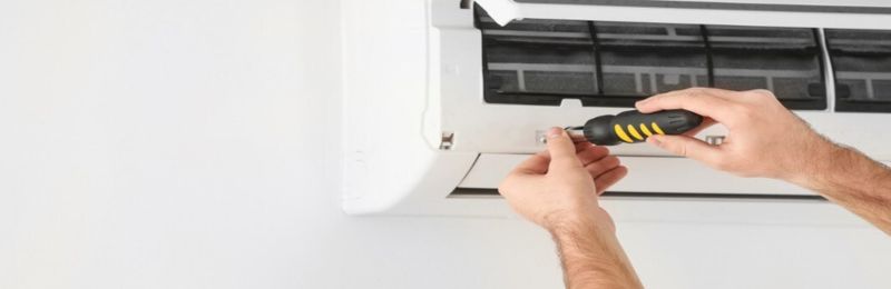HVAC technician performing an air conditioner tune up in Phoenix AZ